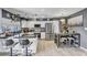 Open kitchen layout featuring white cabinets, black countertops, and an adjacent dining area at 2505 E Hampton Ave, Mesa, AZ 85204