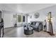 Comfortable living room featuring neutral colors, modern decor, and wood-look flooring at 2505 E Hampton Ave, Mesa, AZ 85204
