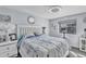 Bright main bedroom with a comfortable bed, modern fan and window at 2505 E Hampton Ave, Mesa, AZ 85204