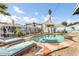 Outdoor oasis with a freeform pool, lush landscaping, and lounge chairs at 2505 E Hampton Ave, Mesa, AZ 85204