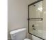 Bathroom featuring a shower and bathtub combo with modern sliding glass doors at 2506 E Bridgeport Pkwy, Gilbert, AZ 85295