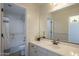Bright bathroom featuring a single sink vanity and bathtub with shower at 2506 E Bridgeport Pkwy, Gilbert, AZ 85295
