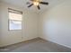 Bedroom with a ceiling fan, neutral walls and carpeted floors at 2506 E Bridgeport Pkwy, Gilbert, AZ 85295