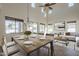 Bright dining area with high ceilings, modern chandelier, and a view to the outside at 2506 E Bridgeport Pkwy, Gilbert, AZ 85295