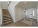 Inviting foyer featuring tile flooring with detailed accents and a staircase to the upper level at 2506 E Bridgeport Pkwy, Gilbert, AZ 85295