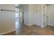 Hallway with decorative tile flooring, leading to bedroom and featuring built-in storage cabinets at 2506 E Bridgeport Pkwy, Gilbert, AZ 85295