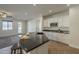 Kitchen featuring granite countertops, white cabinets, stainless steel appliances, and an island with seating at 2506 E Bridgeport Pkwy, Gilbert, AZ 85295