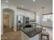 Kitchen with stainless steel appliances, granite counters, white cabinets, and tiled floors at 2506 E Bridgeport Pkwy, Gilbert, AZ 85295
