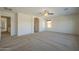 Inviting living room featuring neutral carpet, recessed lighting, and an archway leading to other rooms at 2506 E Bridgeport Pkwy, Gilbert, AZ 85295