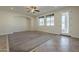 Open living room with tile entryway and carpet, plus lots of windows for natural light at 2506 E Bridgeport Pkwy, Gilbert, AZ 85295