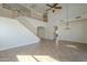 Bright living room featuring an open floorplan, second-story landing and a large picture window at 2506 E Bridgeport Pkwy, Gilbert, AZ 85295