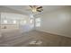 Open living space with carpeted floors, neutral walls, and lots of natural light at 2506 E Bridgeport Pkwy, Gilbert, AZ 85295
