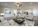 Open-concept living room featuring modern furnishings, adjacent to the kitchen at 2506 E Bridgeport Pkwy, Gilbert, AZ 85295