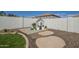 Charming playhouse in a landscaped backyard with concrete patio and rock accents at 2506 E Bridgeport Pkwy, Gilbert, AZ 85295