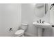 Modern half-bath featuring a white pedestal sink and sleek black fixtures at 25393 N 158Th Ct, Surprise, AZ 85387