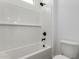 Bathroom with a white tiled shower and updated plumbing fixtures at 25393 N 158Th Ct, Surprise, AZ 85387