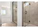 Bathroom featuring a glass shower with gray tiling and black hardware at 25393 N 158Th Ct, Surprise, AZ 85387