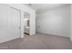 Bright bedroom featuring neutral carpet and ensuite bathroom at 25393 N 158Th Ct, Surprise, AZ 85387