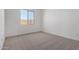 Bedroom featuring neutral carpet and backyard views at 25393 N 158Th Ct, Surprise, AZ 85387