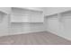 Walk-in closet with neutral carpet and white shelving at 25393 N 158Th Ct, Surprise, AZ 85387