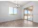 Bright dining area with large windows and sliding door access to the backyard at 25393 N 158Th Ct, Surprise, AZ 85387