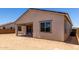 Rear view of home featuring covered patio and large yard at 25393 N 158Th Ct, Surprise, AZ 85387