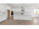 Open kitchen featuring white cabinets, a large island, and stainless steel appliances at 25393 N 158Th Ct, Surprise, AZ 85387