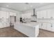 A spacious kitchen featuring white cabinets, a large island, and stainless steel appliances at 25393 N 158Th Ct, Surprise, AZ 85387