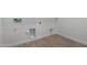Neat laundry room with white walls and wood-look tile flooring at 25393 N 158Th Ct, Surprise, AZ 85387