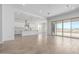 Expansive living space with a modern kitchen and sliding glass doors to the patio at 25393 N 158Th Ct, Surprise, AZ 85387