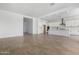 Spacious living room with tile floors and views of the kitchen and patio at 25393 N 158Th Ct, Surprise, AZ 85387