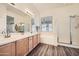 Bright bathroom with double vanity, large mirrors and plenty of storage at 2730 W Via Calabria St, Phoenix, AZ 85086