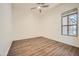 Neutral bedroom with hardwood floors, natural lighting and a ceiling fan at 2730 W Via Calabria St, Phoenix, AZ 85086