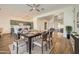 Open dining area with modern table, chairs, and seamless access to the kitchen and living spaces at 2730 W Via Calabria St, Phoenix, AZ 85086