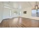 Bright living room featuring wood floors, neutral paint, and plenty of natural light at 2730 W Via Calabria St, Phoenix, AZ 85086