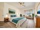Inviting main bedroom with plush bedding, stylish decor, and a serene view from the window at 2730 W Via Calabria St, Phoenix, AZ 85086