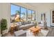 Bright sun room with comfortable seating, large windows overlooking the backyard play area at 2730 W Via Calabria St, Phoenix, AZ 85086