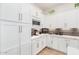 Stylish kitchen with white cabinets, granite countertops, and black backsplash offering a clean, modern look at 2777 W Queen Creek Rd # 9, Chandler, AZ 85248