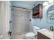 This bathroom has a tiled shower, wood cabinet, marble countertop, and classic fixtures at 2801 E Sylvia St, Phoenix, AZ 85032