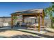 Outdoor living space with a covered cabana area and a lounge area at 2801 E Sylvia St, Phoenix, AZ 85032