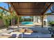 Relaxing outdoor cabana with views of the pool and backyard at 2801 E Sylvia St, Phoenix, AZ 85032