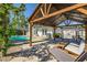 Covered cabana overlooking pool and outdoor kitchen area at 2801 E Sylvia St, Phoenix, AZ 85032