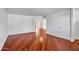 Hardwood flooring and modern paint create a seamless transition between living spaces, enhancing the home's appeal at 2801 E Sylvia St, Phoenix, AZ 85032