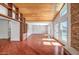 The living room features a wood ceiling, stone fireplace, and glass doors to the pool area at 2801 E Sylvia St, Phoenix, AZ 85032