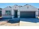Charming single-story home featuring a two-car garage, stucco exterior, and covered front entry at 28228 N Nealite Dr, San Tan Valley, AZ 85143