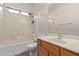 Full bathroom with a shower-tub combo, white tiling, and modern sink at 2834 N Paisley Ln, Casa Grande, AZ 85122