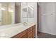 Well-lit bathroom featuring a vanity with a countertop and a large mirror at 2834 N Paisley Ln, Casa Grande, AZ 85122