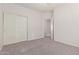 Bedroom featuring plush carpeting, fresh paint and closet doors, ready for personalization at 2834 N Paisley Ln, Casa Grande, AZ 85122