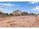 Spacious home exterior with large backyard, expansive dirt, and neighborhood views at 2834 N Paisley Ln, Casa Grande, AZ 85122