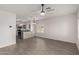 Open-concept living room showcasing modern light fixtures and adjacent kitchen area at 2834 N Paisley Ln, Casa Grande, AZ 85122
